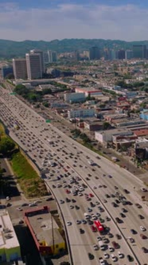 Beautiful sunny panorama of lively American city. Busy traffic on roads of Los Angeles