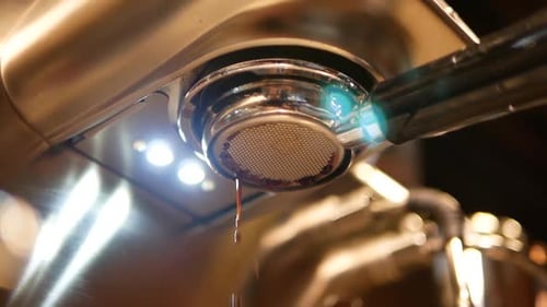 Close Up Footage of Coffee Extraction Showing The Coffee Liquid Dripping Down From The