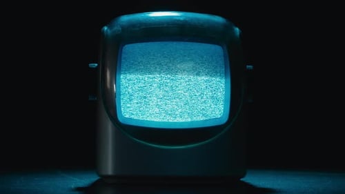 Vintage Television Showing Static in the Dark