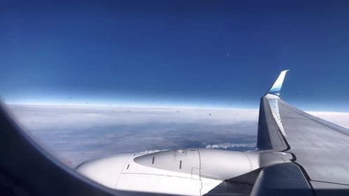 Airplane Window View: Clouds, Storm, and Landing