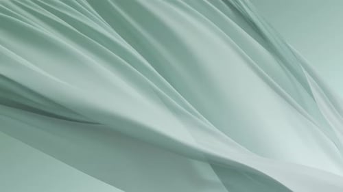 Soft Mint Green Fabric Flowing Gracefully in Air Creating Elegant Minimal Texture Background with