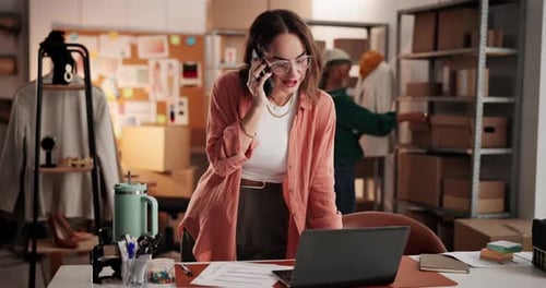 Woman on Phone in Warehouse Office