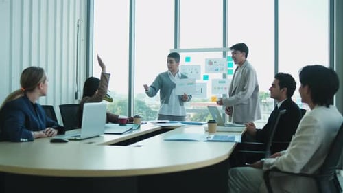 Business Meeting Presentation with Diverse Team in Modern Office