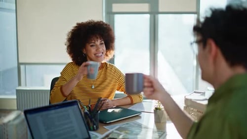 Smiling Colleagues Clinking Cups Taking Break at Construction Office Closeup