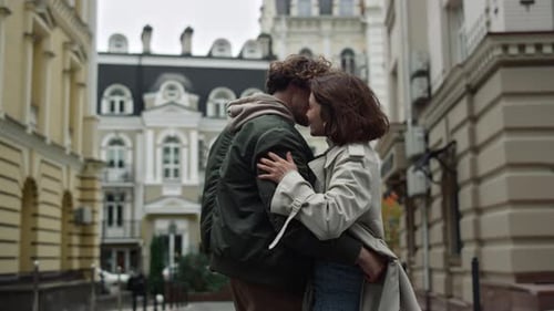 Lovely Couple Dancing In City Center During Date. Cheerful Woman And Man Feeling Happy Together O...