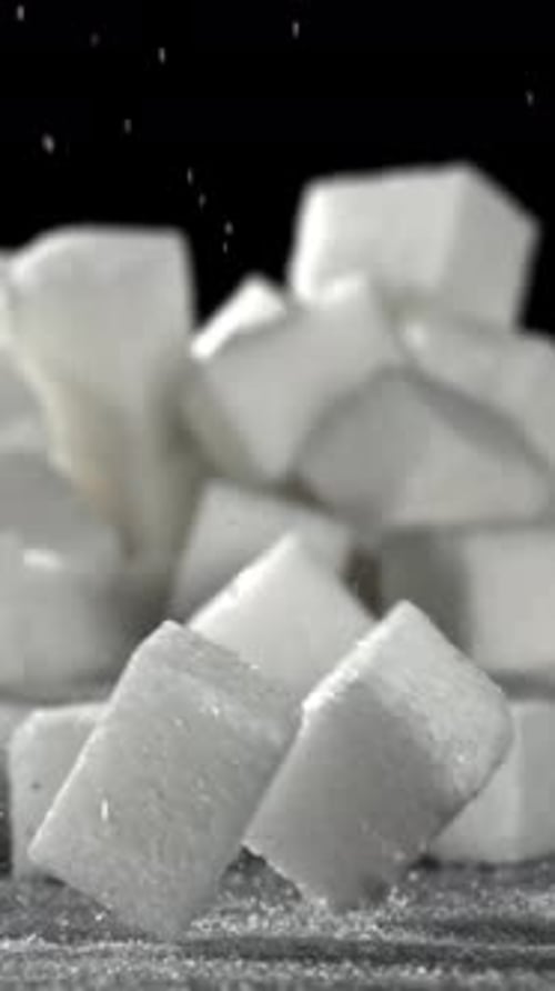 Sugar Cubes Fall on the Table Filmed on a Highspeed Camera at 1000 Fps