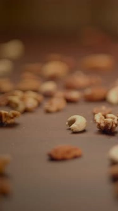 Assorted Nuts Poured onto Brown Surface