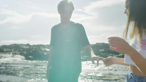 Young Couple Embrace on Picturesque Beachfront Vacation