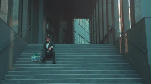 Quiet Figure Stands Still Before Voyage Begins Person Holding Box Pauses Silently Prior to Uncertain