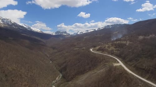 Flying Above Canyon River And Empty Road In Mountains