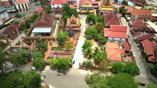 Aerial footage of Wat Preah Prom Rath in Siem Reap, Cambodia with surrounding greenery