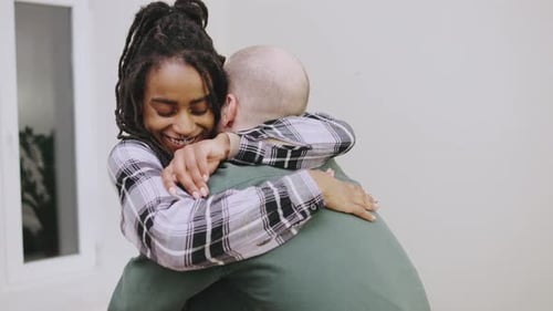 Loving Couple Hugging Affectionately Indoors