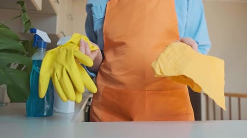 Preparing to Clean House with Yellow Gloves