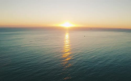 4k video footage of the sun setting over an ocean
