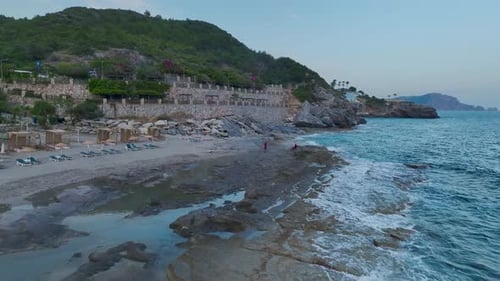 Aerial View Serene Mediterranean Beach with Golden Sands and Clear Waters