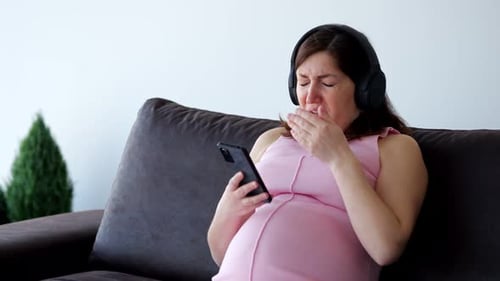 Pregnant Woman Crying While Listening to Music