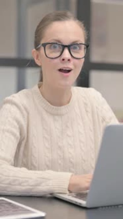 Woman Works on Laptop and is Surprised