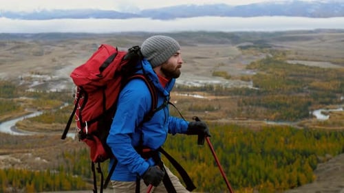 Portrait of Man Hiker Doing Hiking Outdoors Mountain Background Caucasian Male Walks with Sticks and