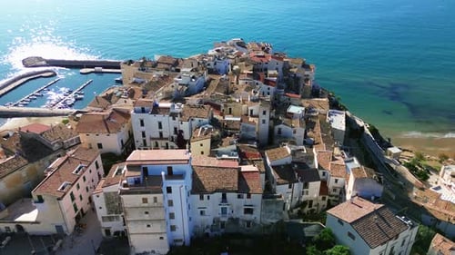 Coastal Cliffside Town with Harbor and Beach