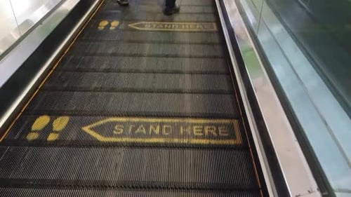 Passengers walks at Escalator at Airport of Soekarno-Hatta, Part of Angkasa Pura Company.