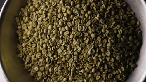 Close Up Of Green Coffee Beans Inside Container