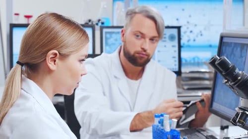 Scientists Working in Modern Laboratory Setting