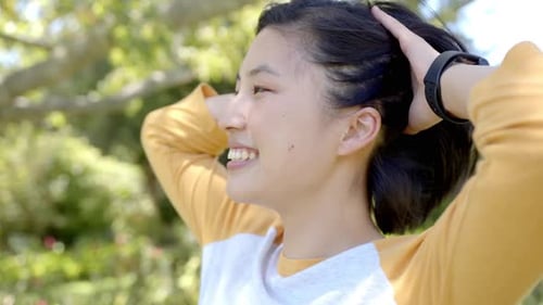 Smiling Woman Enjoying Fresh Air Outdoors