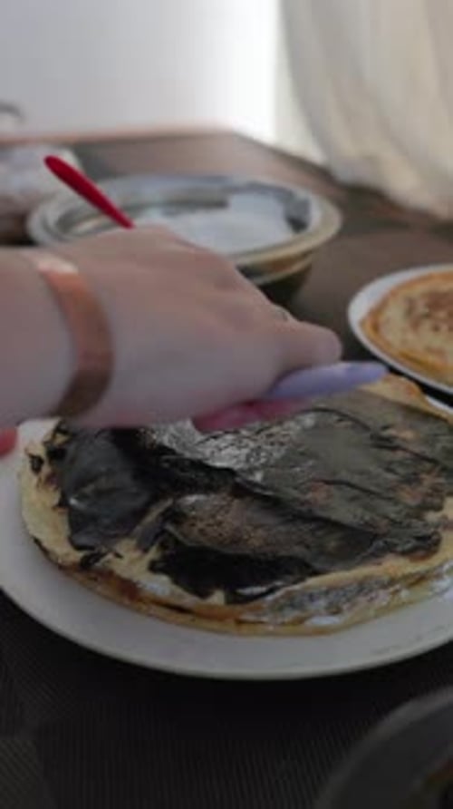 Vertical Close-Up of Cake Frosting Application