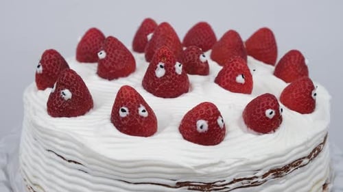Playful Cake Decorated With Strawberry Characters