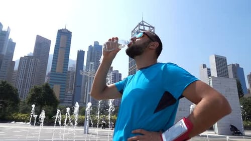 Young Jogger Drinking Water After Run, Super 240