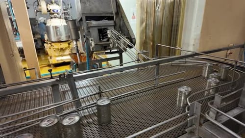 Silver Cans Conveyor Belt in a Food Factory