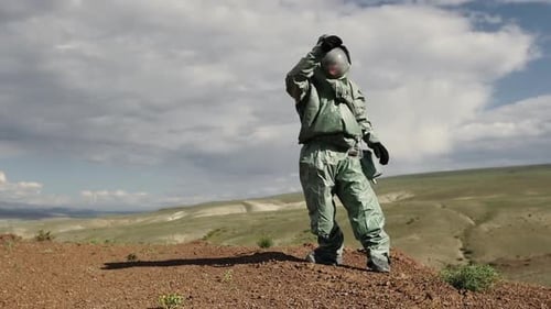 An Ecologist a Biologist in a Protective Suit Dropped and Broke a Test Tube with Material for