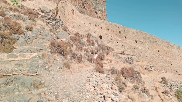 Steep medieval rampart fortress walls Monemvasia Mediterranean town ...