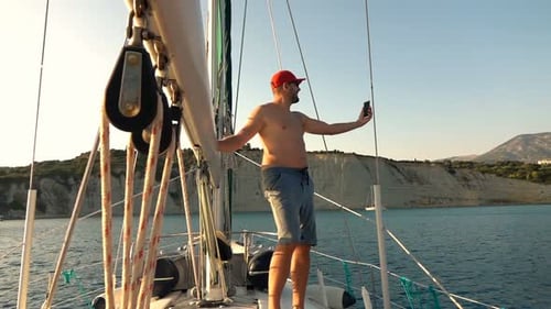 Man Taking Selfie Photo While Sailing Boat on Sea, Super