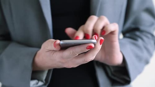 Woman Typing on Modern Smartphone Device Close Up