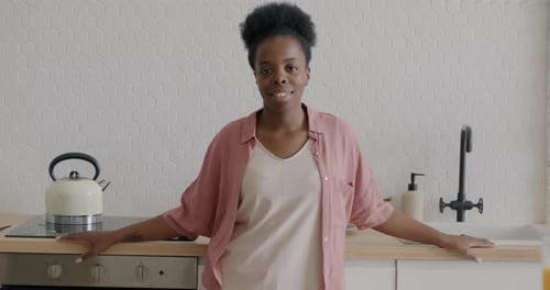 Smiling Woman Posing in a Kitchen