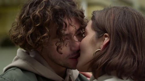 Portrait of Love Couple Kissing on Date in City Center. Affectionate Woman