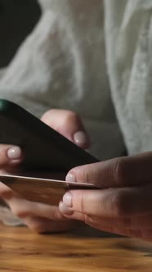 Vertical Video Person Making Payments on Ecommerce Sites with Bank Card