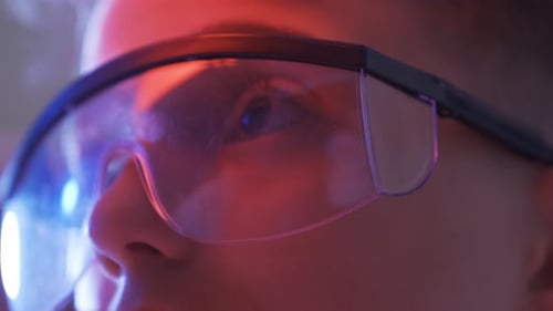 Tech-savvy boy, close-up eye. High tech and kid expression.