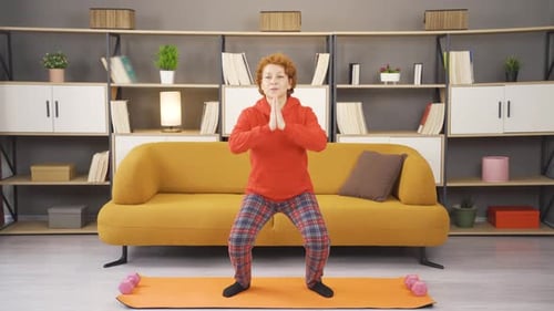 Exercising woman doing squats.