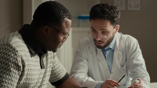 Doctor Teaching Patient to Use Glucose Meter