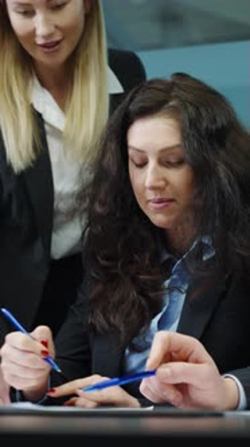 Women Collaborating in Modern Corporate Office