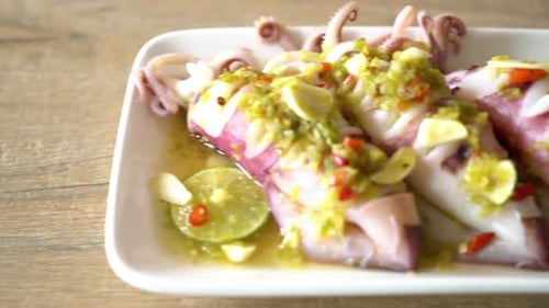 Spicy Squid Dish Topped with Lemon and Garlic
