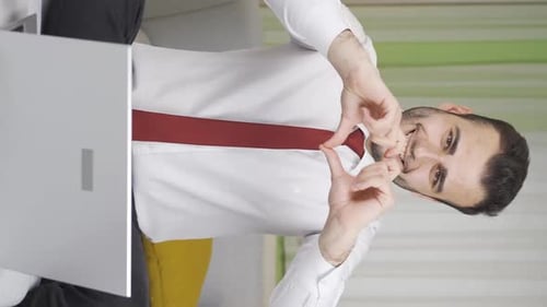 Young Adult Making Heart Shape Online