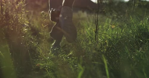 Girl running through the grass