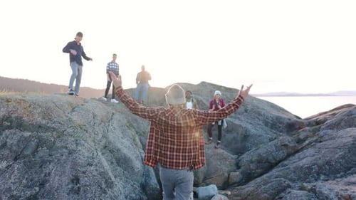 Group of Friends Hiking in Nature on Log