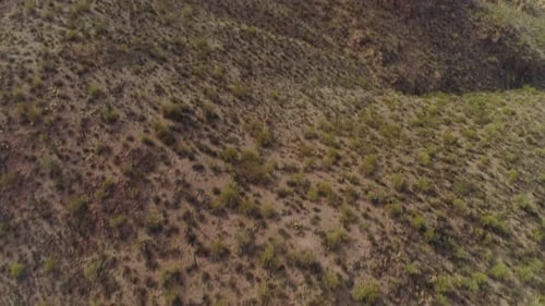 AERIAL - Drone Tilt Up to Reveal Desert Mountain (Superstition Mountains)