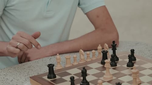 Man Thinking About His Next Chess Move