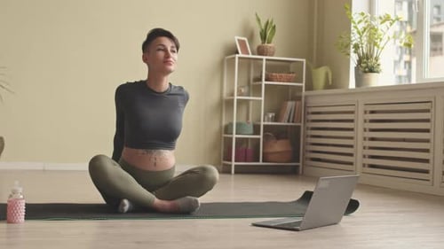 Pregnant Woman Doing Yoga at Home