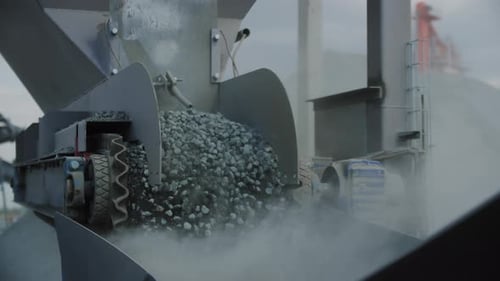 Rotating Pulleys Loads Gravel in Container at Mining Quarry